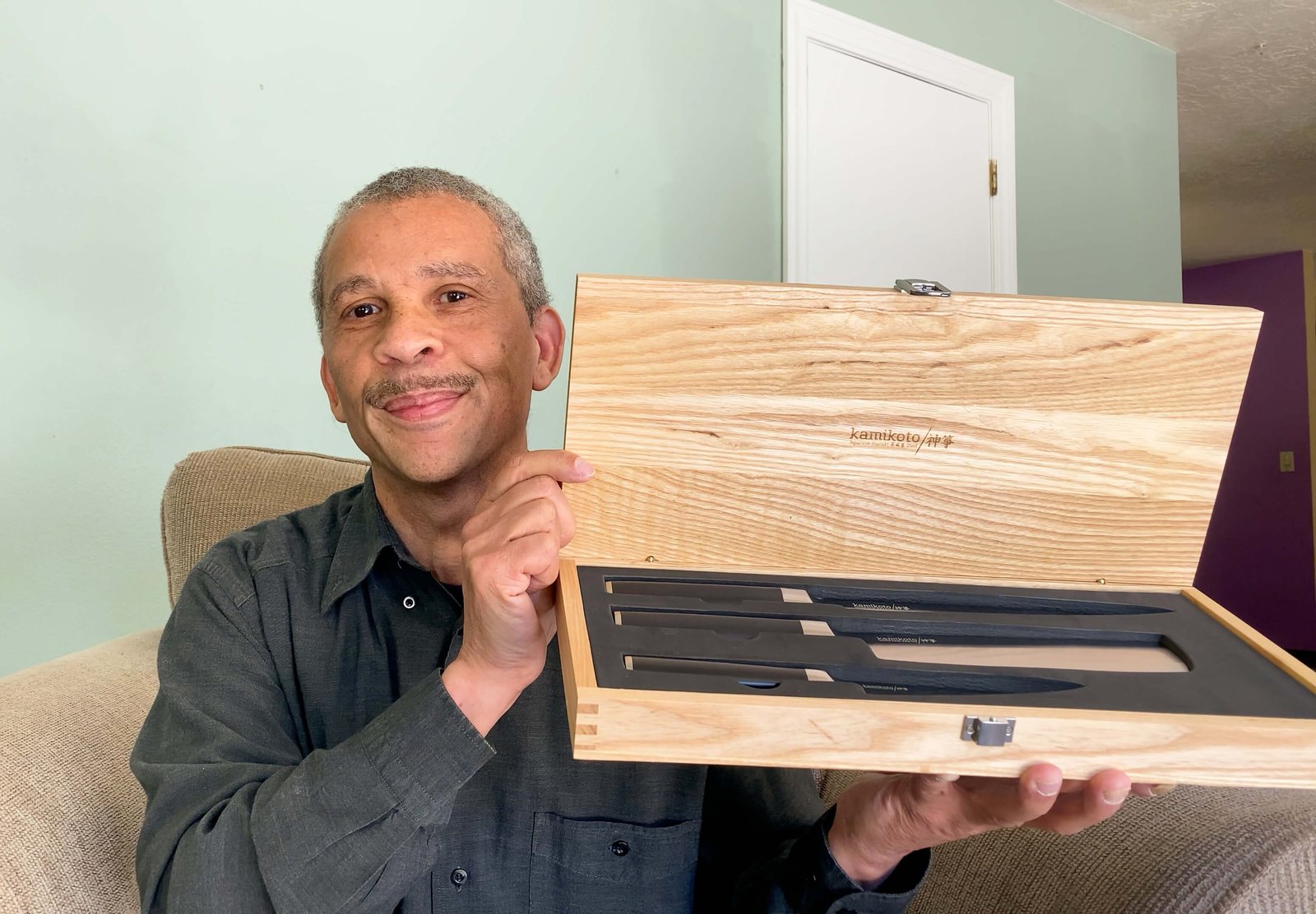 A member holding the knife set he won