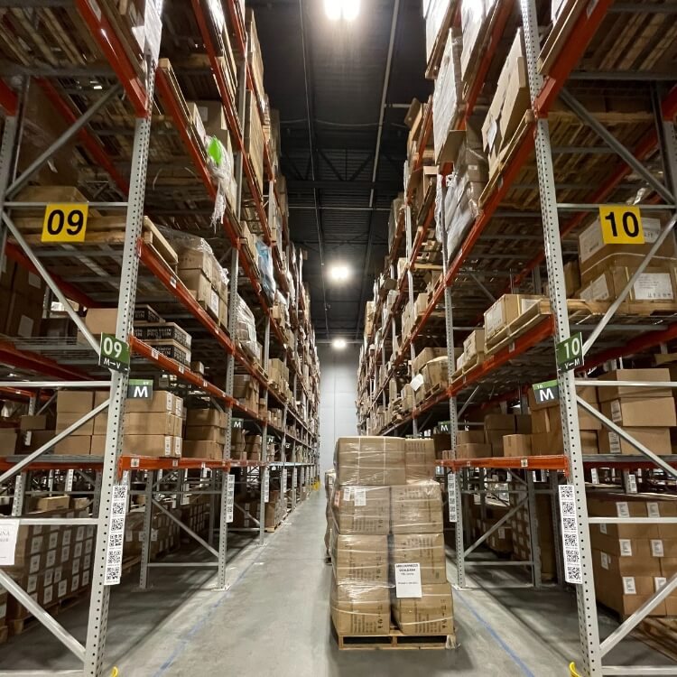Warehouse aisle with pallets of inventory